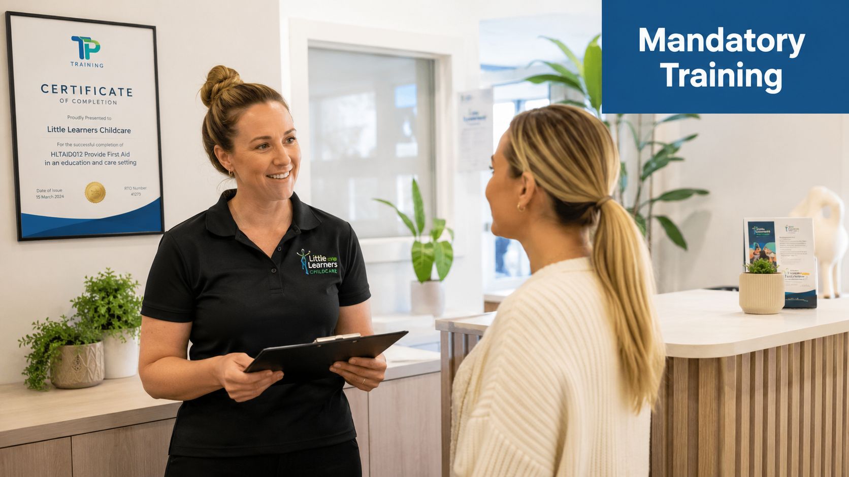 A professional woman in a Little Learners Childcare polo holding a clipboard while talking to a parent.